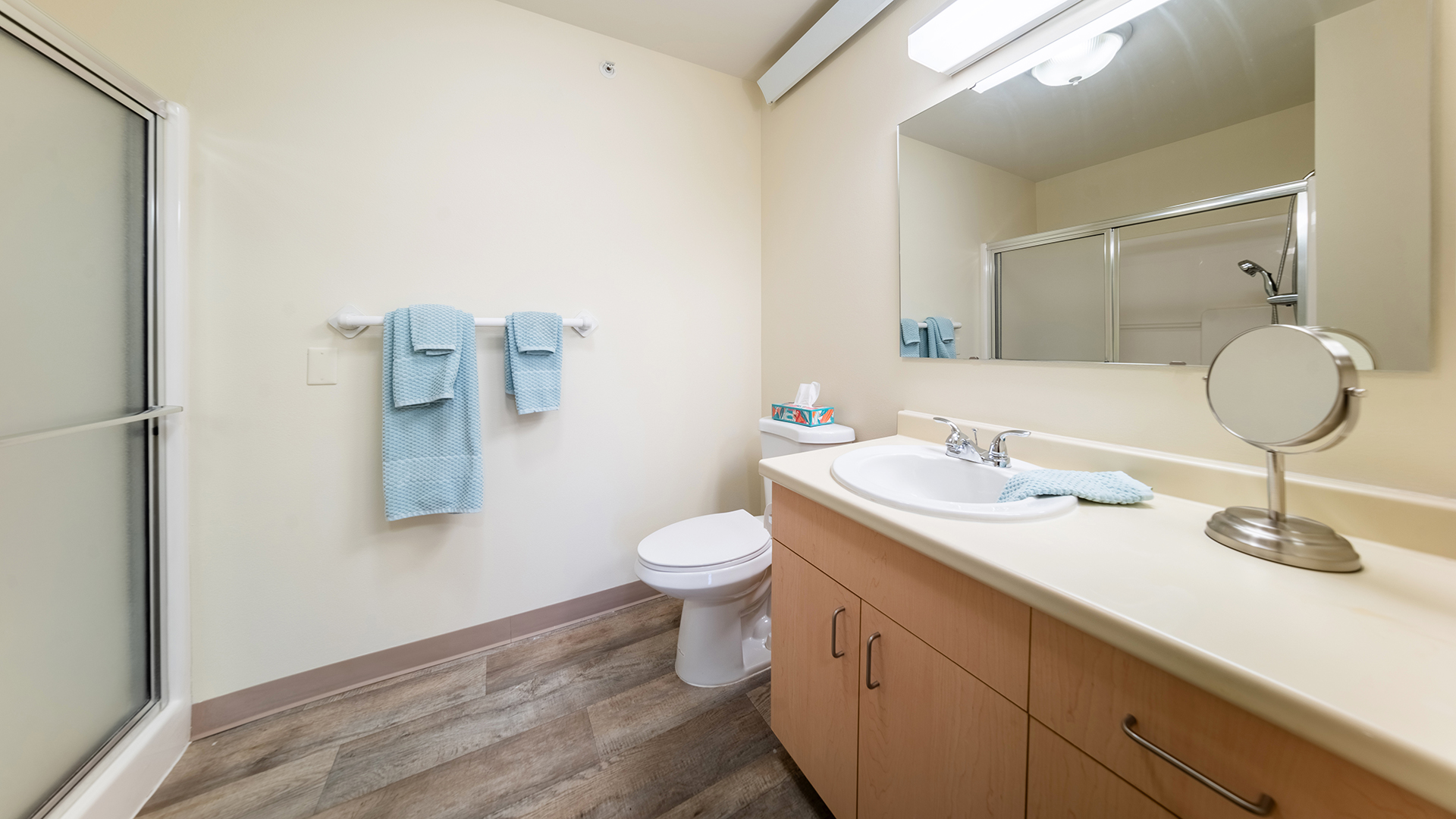 Bathroom with light blue washcloths and towels