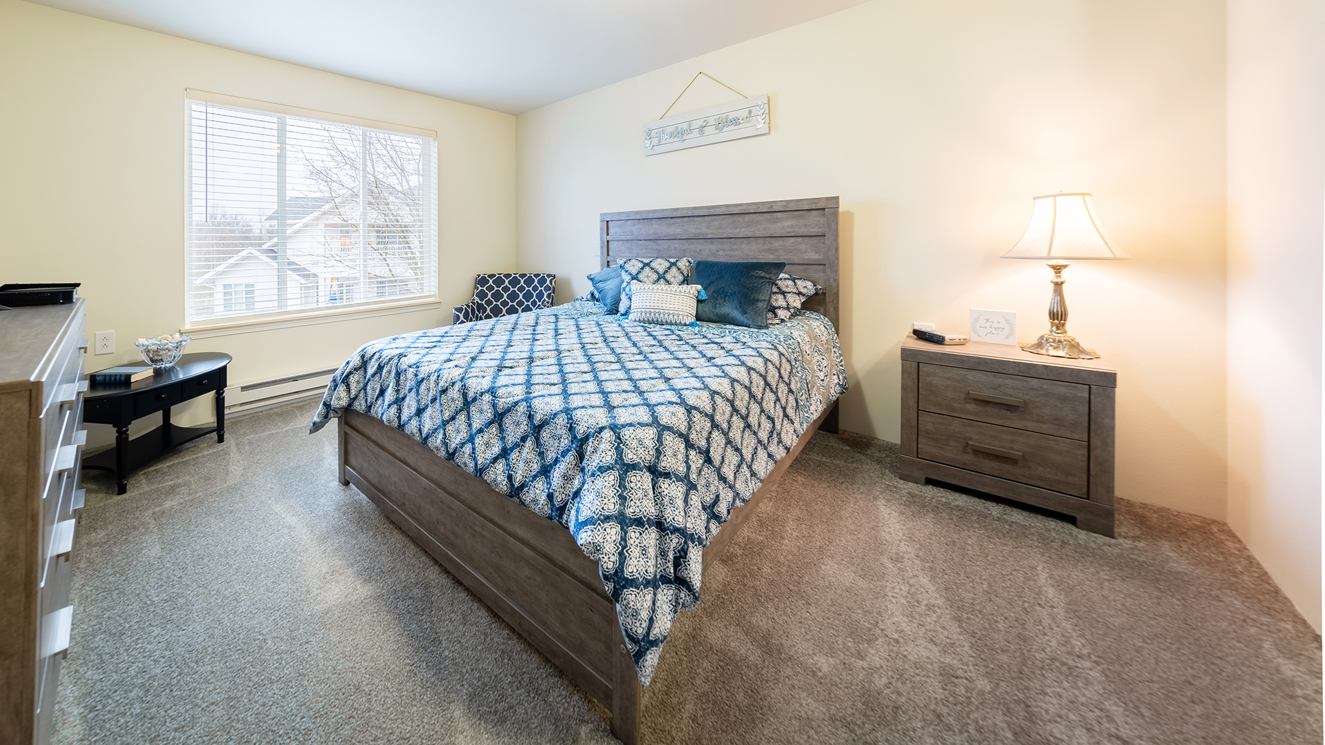 Bedroom with blue patterned bedspread