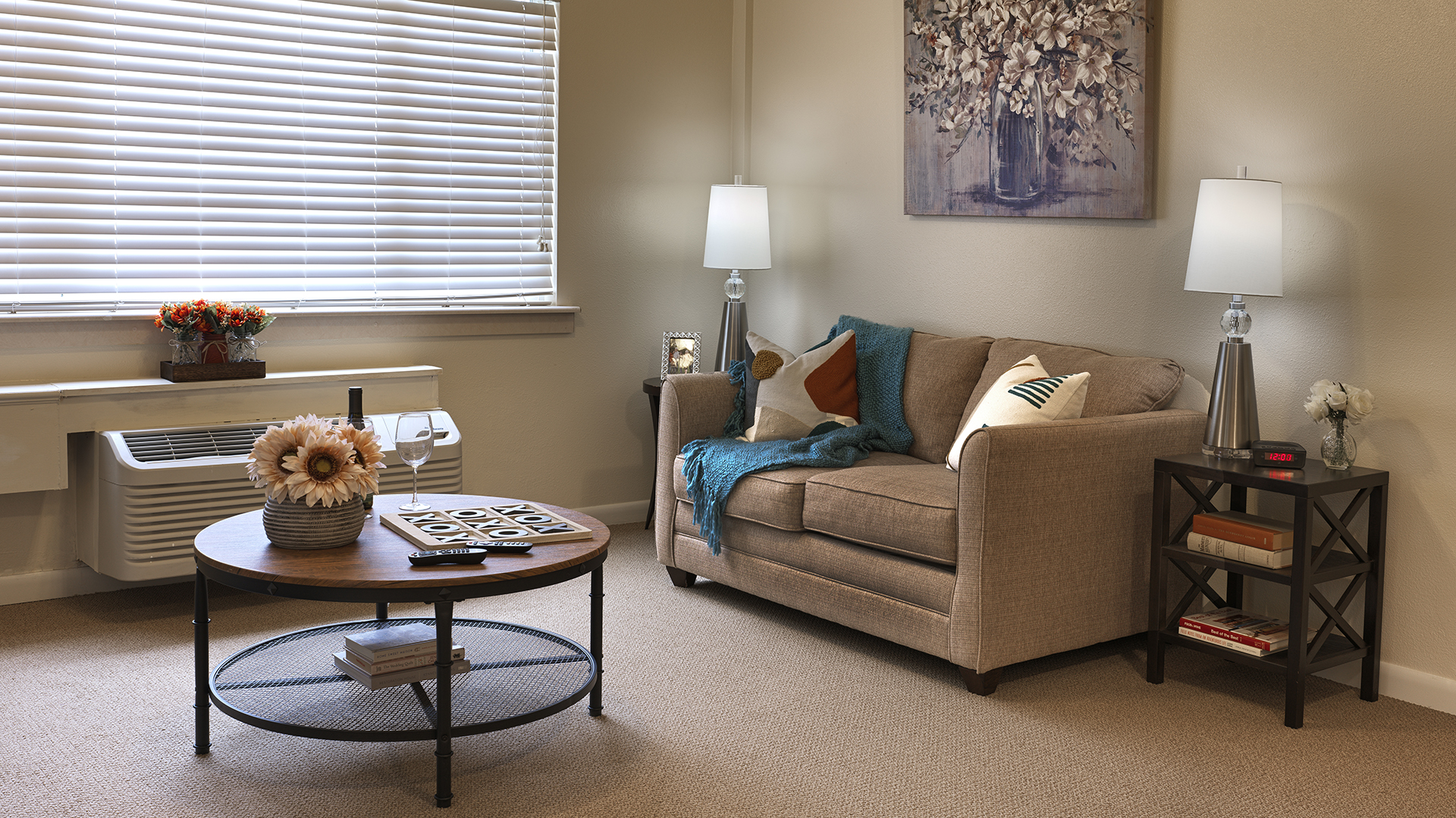 Apartment living room with glass coffee table and sofa