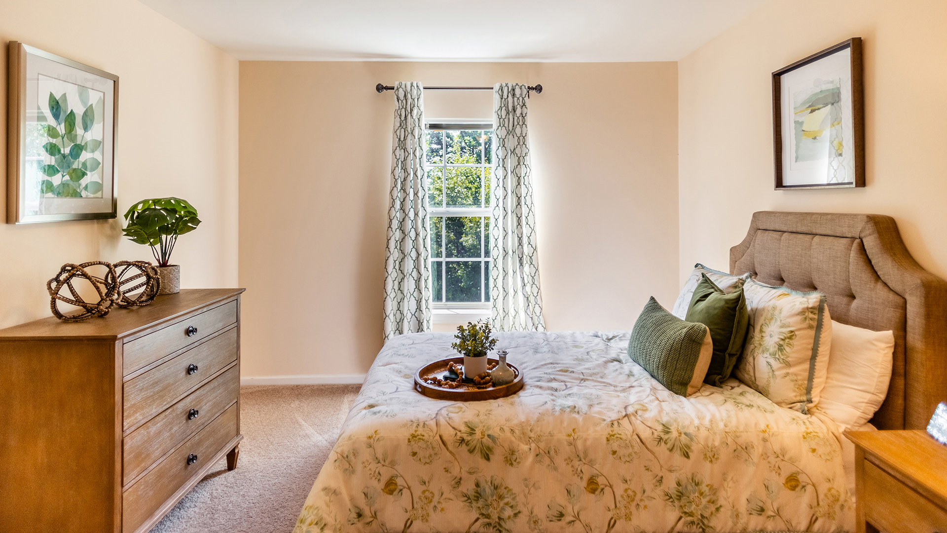 Bedroom with bed featuring floral bedspread