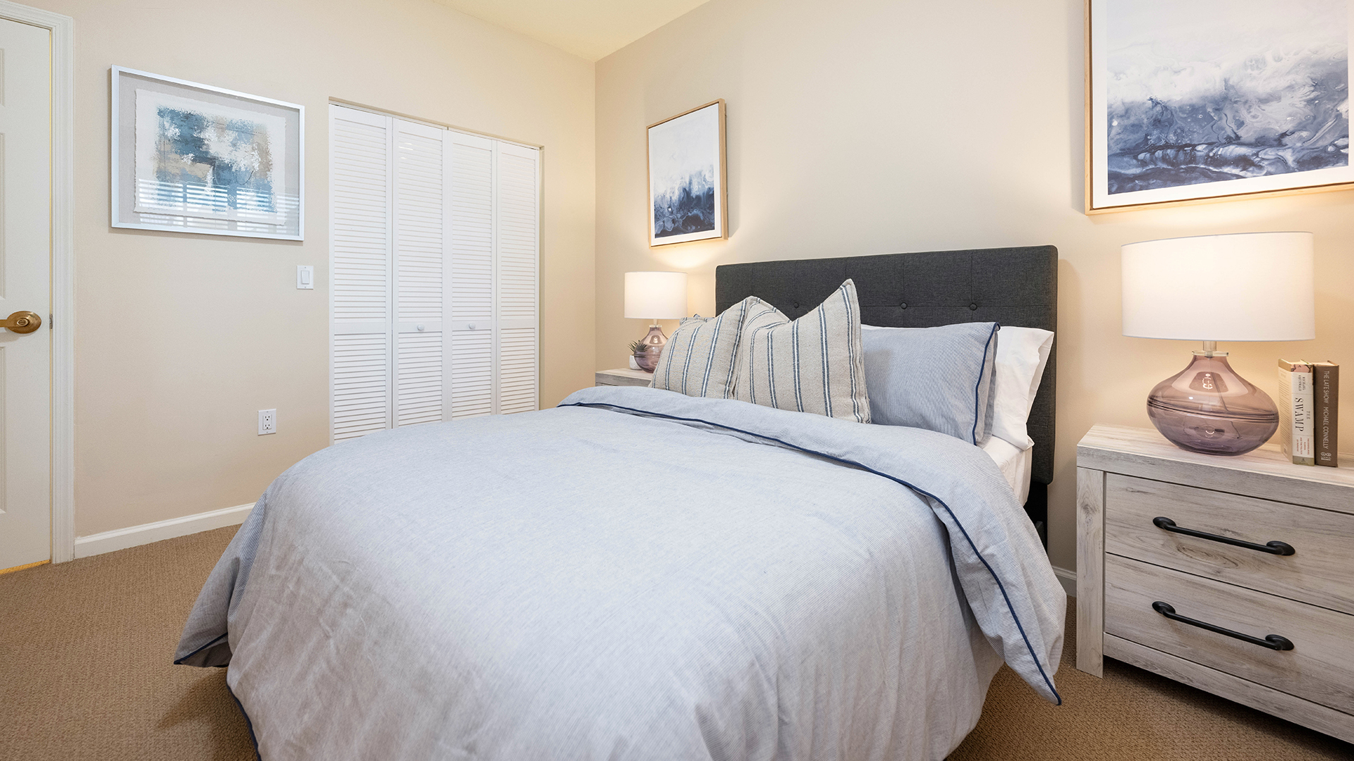 Atria Park of St. Josephs apartment bedroom with queen bed and night stand