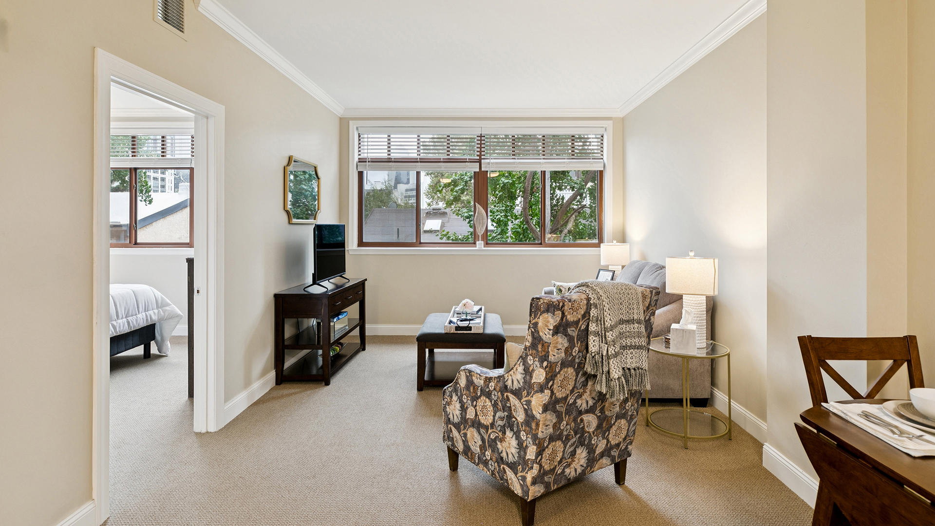 Apartment living room looking into the bedroom