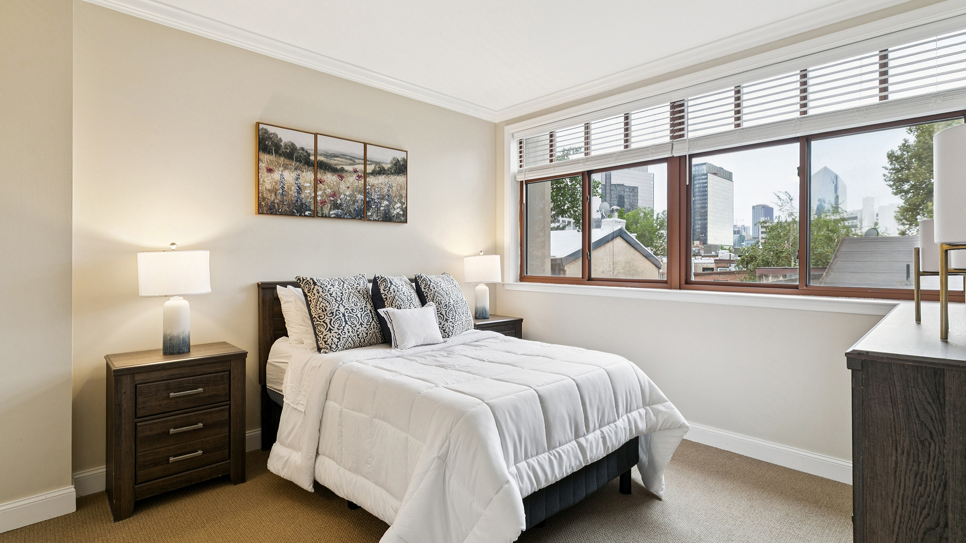 Apartment bedroom looking out to the city