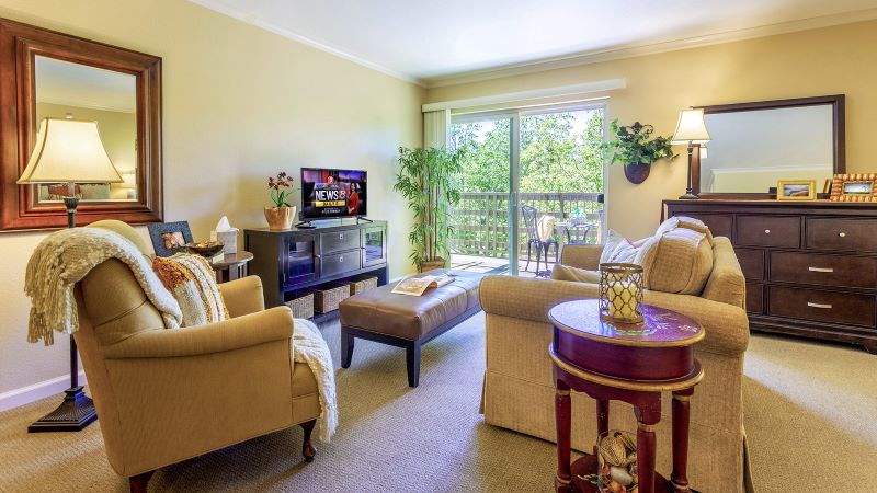 Private senior apartment living room at Atria Valley View.